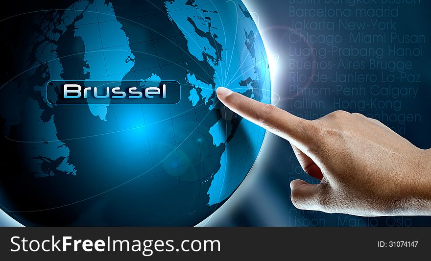 A woman finger point Brussel city on the world map. A woman finger point Brussel city on the world map