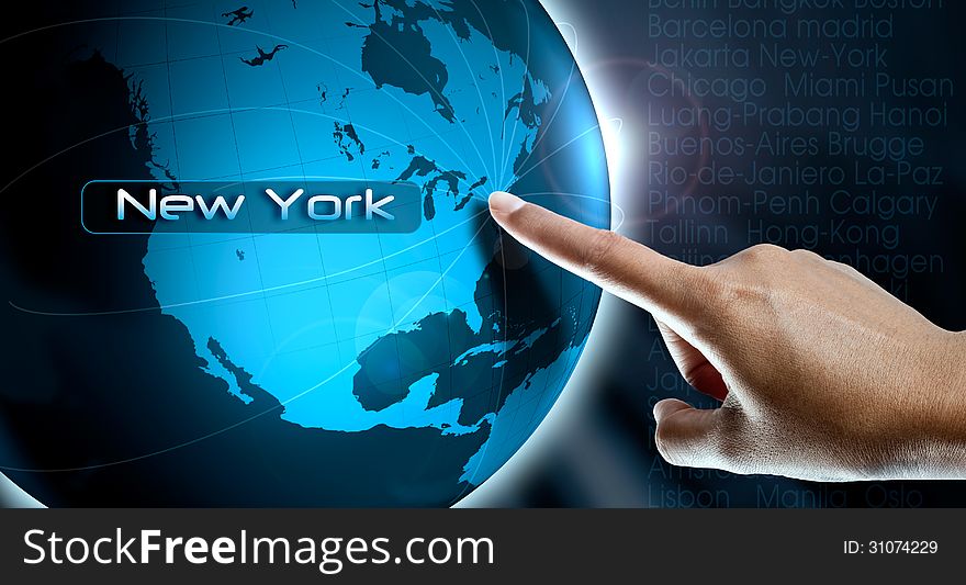 A woman finger point New York city on the world map. A woman finger point New York city on the world map
