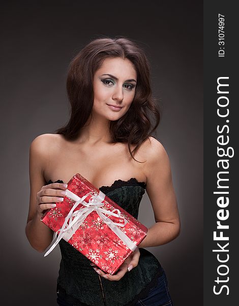 Beautiful Woman With Gift On Grey