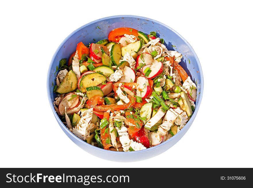 Salad from cucumbers, tomatoes and radish in the plastic plate isolated on white background