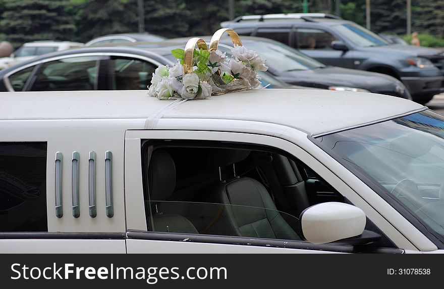 Gold rings on wedding limousine