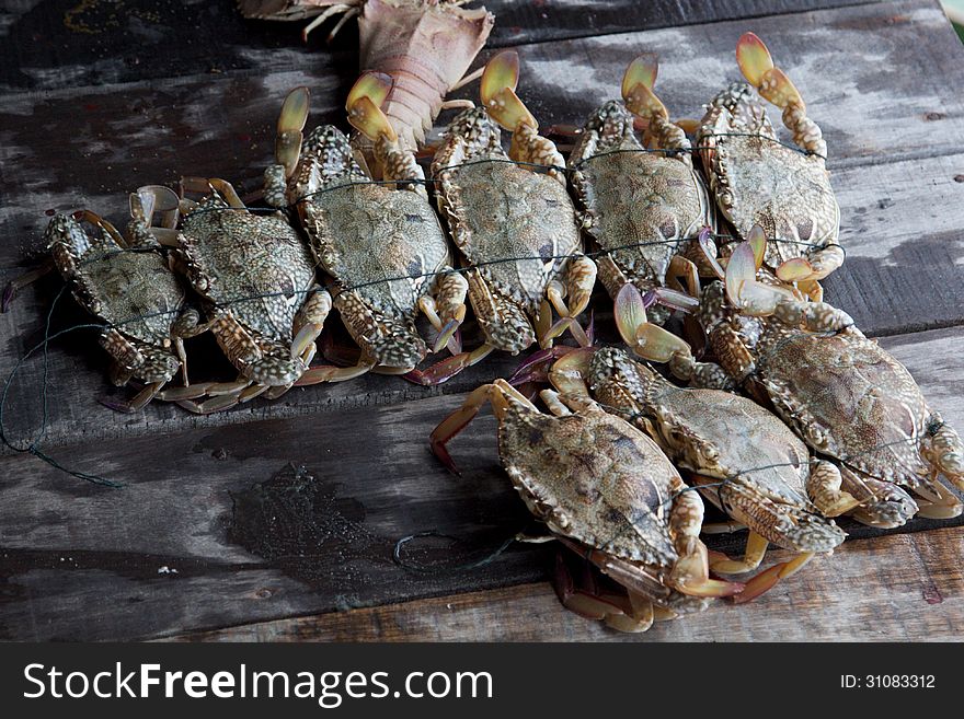 Grey crabs in a market