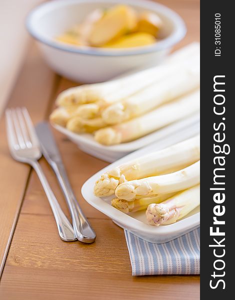 Prepared Raw Peeled White Asparagus On Two White Plate