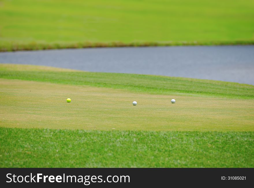 Three Golf Balls On The Green