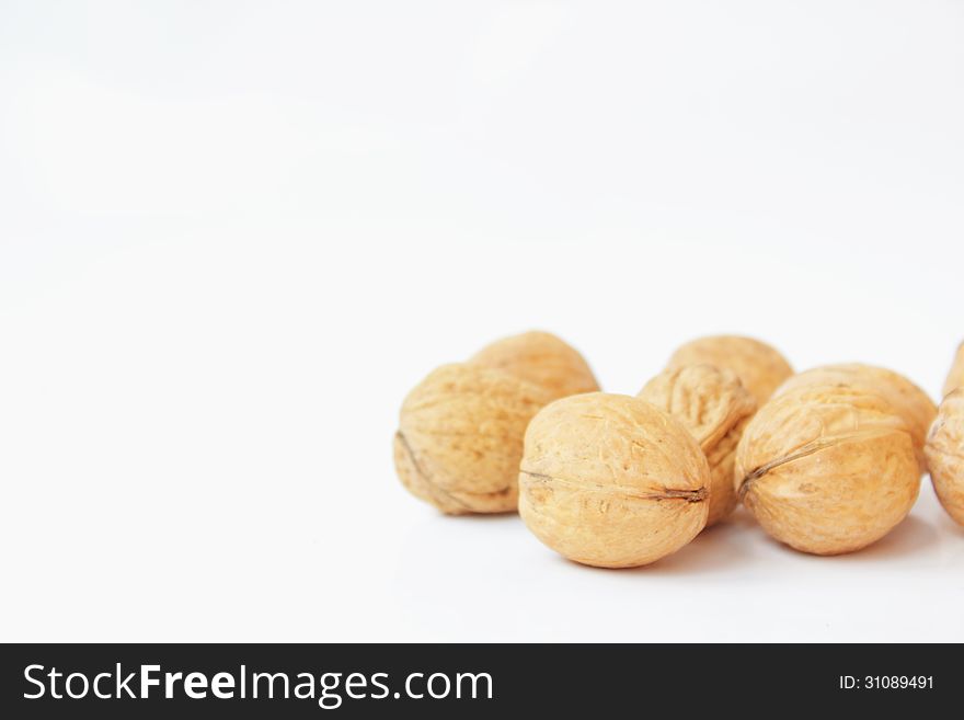 Walnuts On A White Background