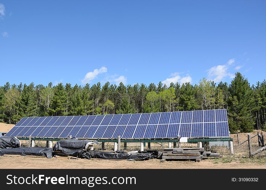 Solar panels under blue sky. Solar panels under blue sky