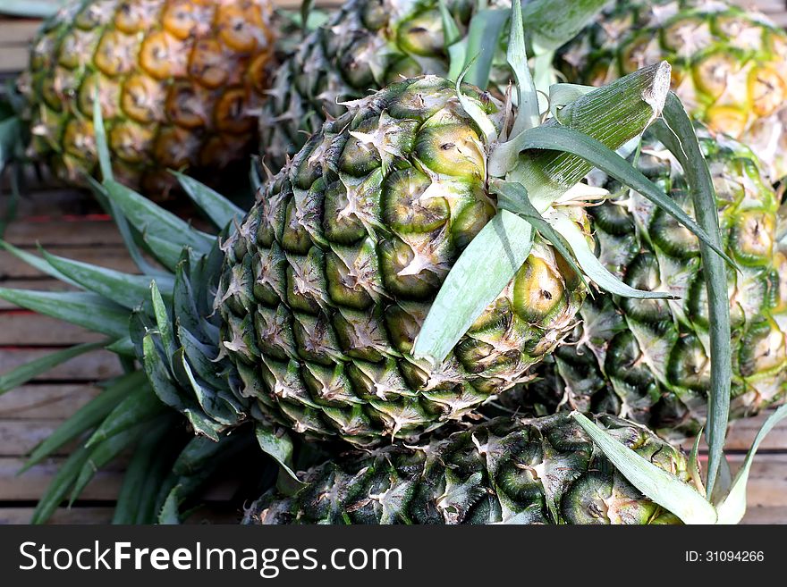 Fresh pineapple on market tray