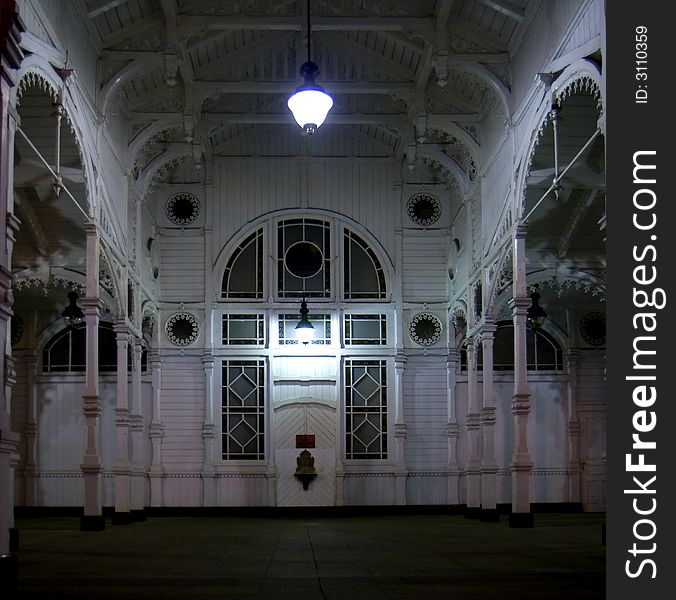 Old white gazebo at night