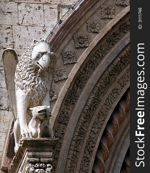 A griffin at the side of entrance of the Palazzo dei Priori in Perugia, Umbria, Italy. A griffin at the side of entrance of the Palazzo dei Priori in Perugia, Umbria, Italy