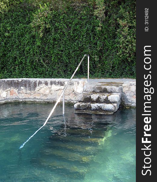 A pool ladder and relaxation water. A pool ladder and relaxation water