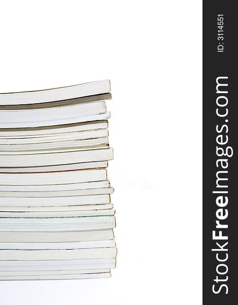 Pile of books stacked - isolated over white. Pile of books stacked - isolated over white