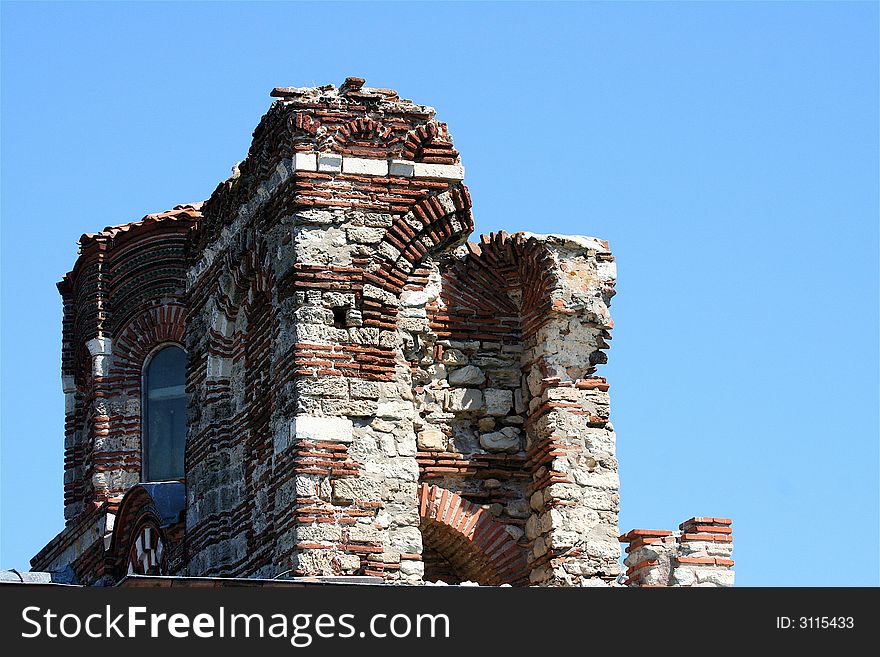 The top of an old church with the unusual repeataple pattern of brickwork. The top of an old church with the unusual repeataple pattern of brickwork