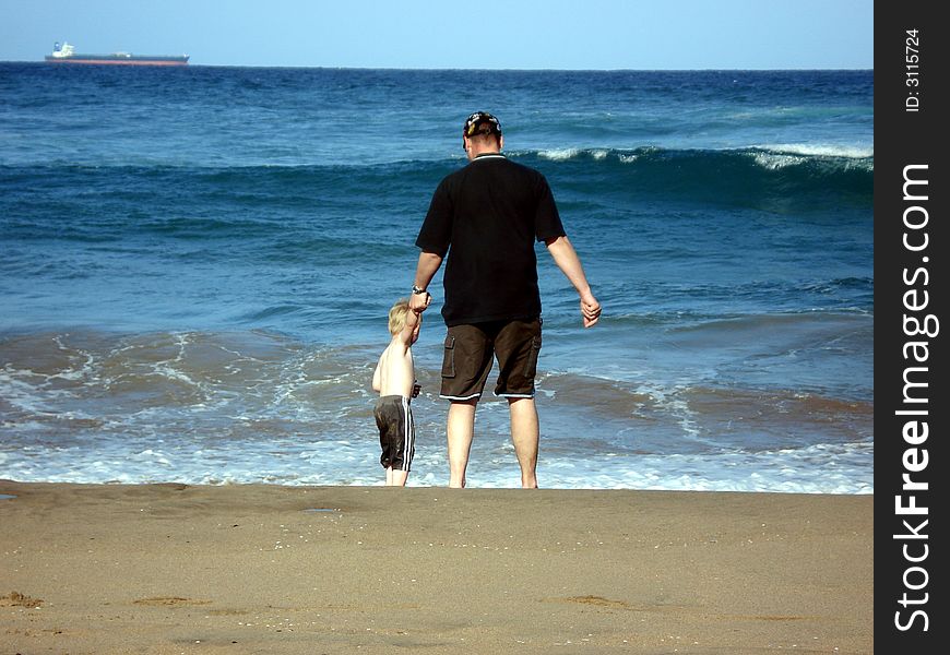 Dad and son at the beach