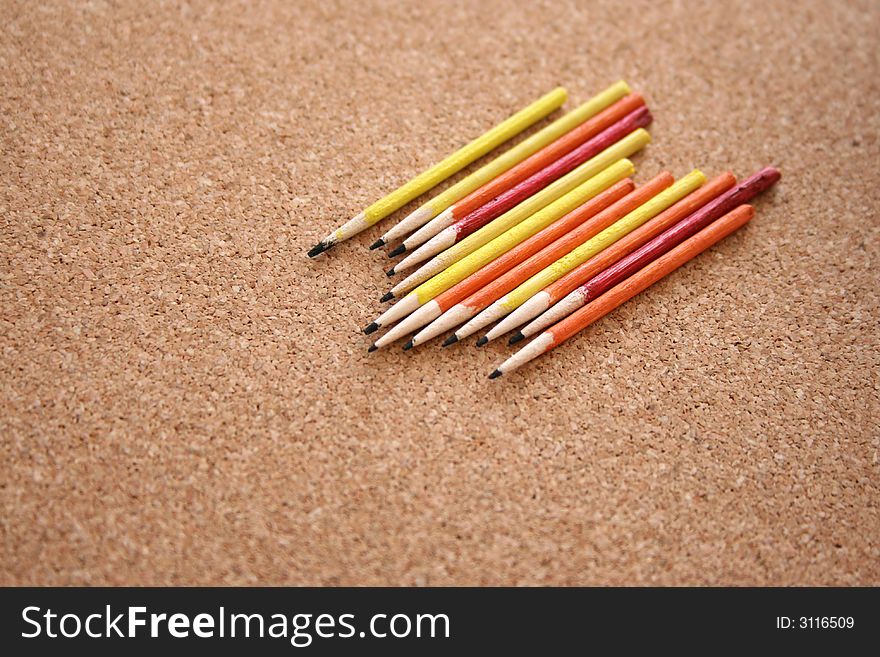 Different colored pencils in a line