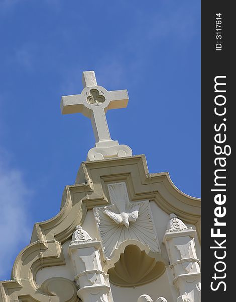 Abstract style image of a cross atop a church with blue sky. Abstract style image of a cross atop a church with blue sky.