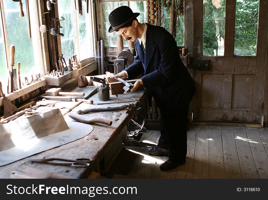 Model Plumber in his Workshop