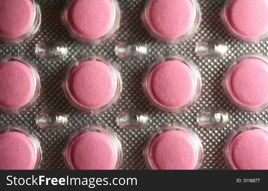 The box of pink tablets (close-up background).