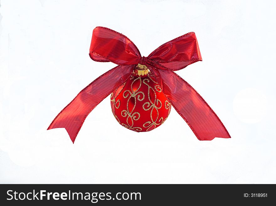 An Isolated Christmas ball with a red ribbon. An Isolated Christmas ball with a red ribbon.