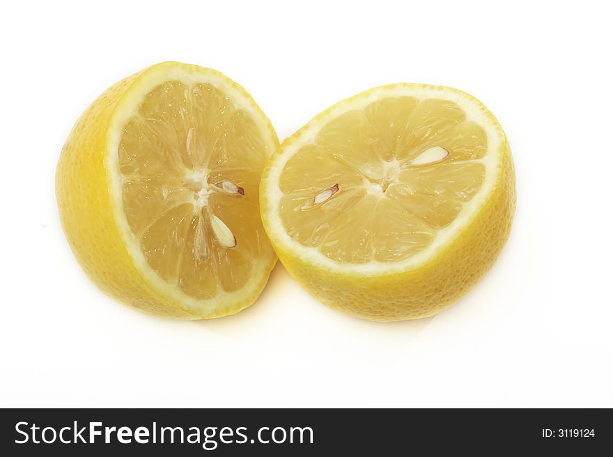 A yellow lemon sliced in the midle. A yellow lemon sliced in the midle