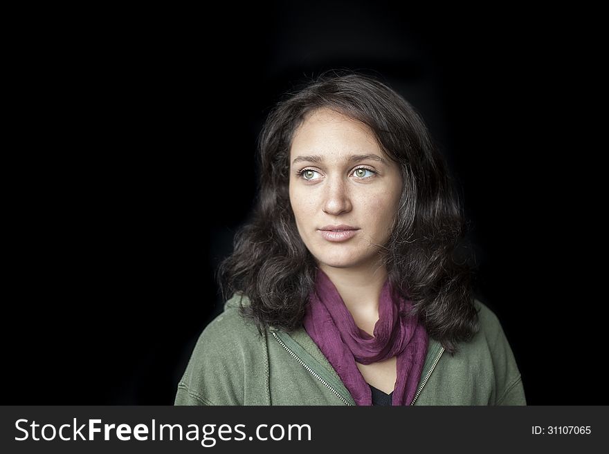 Portrait of a beautiful young woman with striking green eyes. Portrait of a beautiful young woman with striking green eyes.