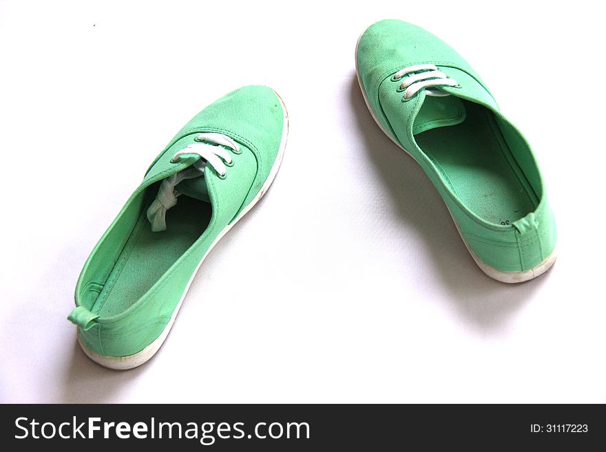 Dirty Green shoes in white background. Dirty Green shoes in white background