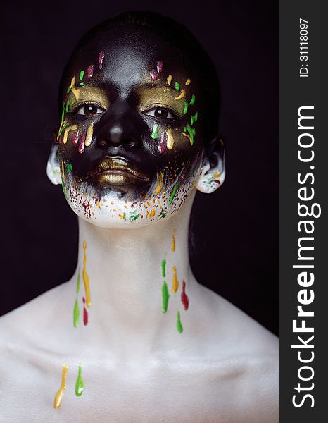 Creative make up with splashes of color close up