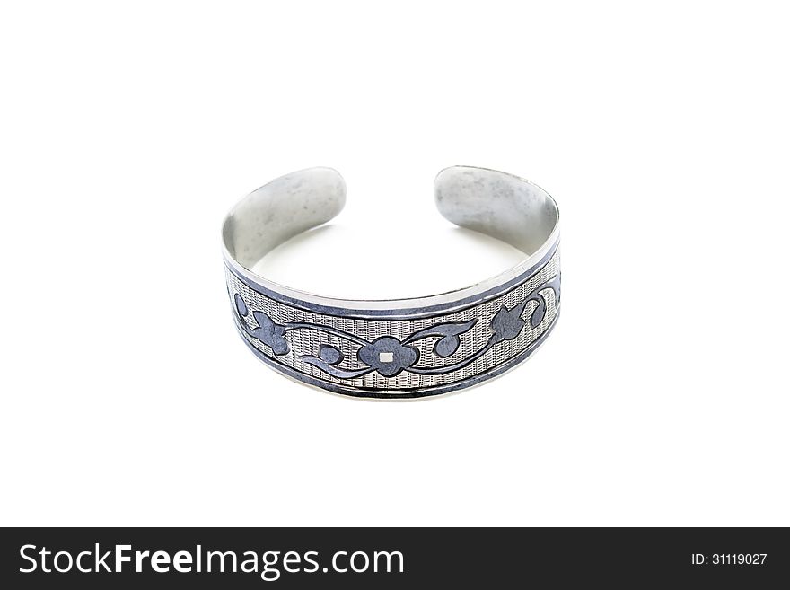 Silver vintage bracelet with black pattern over white. Silver vintage bracelet with black pattern over white