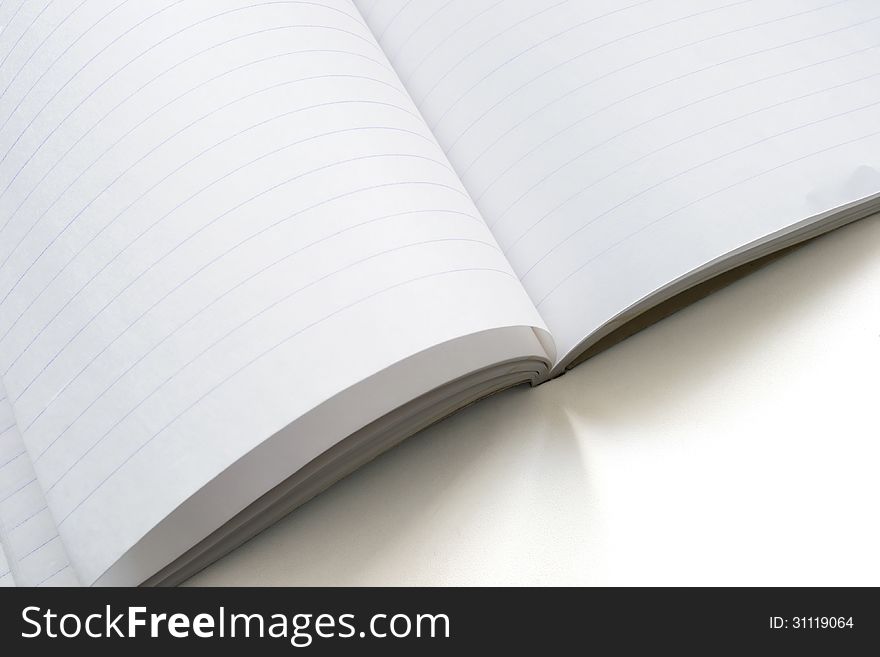 Opened blank notebook with sheets in lines