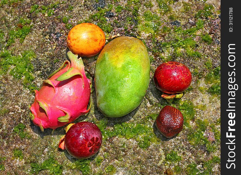 Fresh exotic fruits on natural background. Fresh exotic fruits on natural background