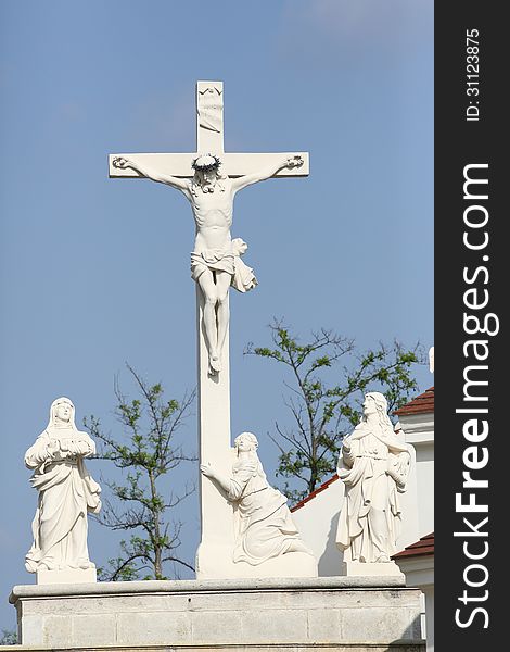 Crucification group on top of baroque way of the cross, mary magdalena, mary and john under the crucified Jesus. Crucification group on top of baroque way of the cross, mary magdalena, mary and john under the crucified Jesus