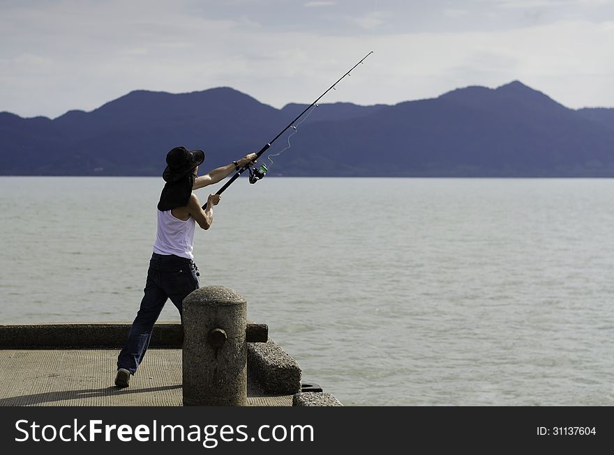 Fisherman fishing trolling in the sea, Chonburi, Thailand