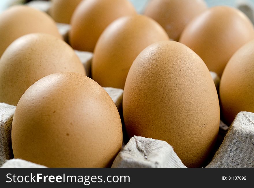 Several eggs in carton basket
