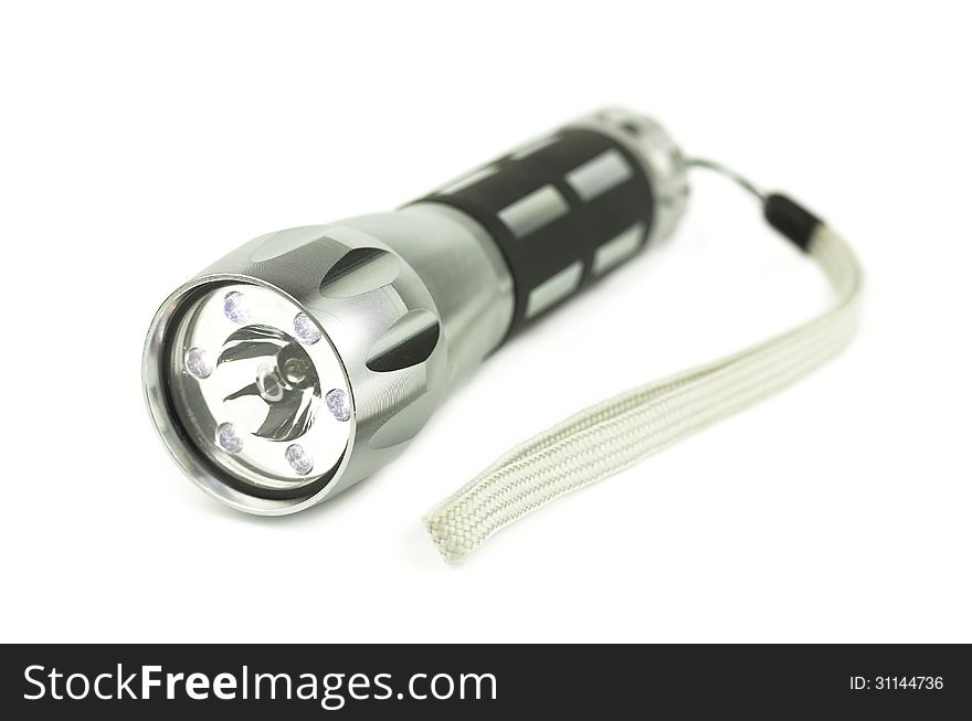 LED metal flashlight. The lantern is on.