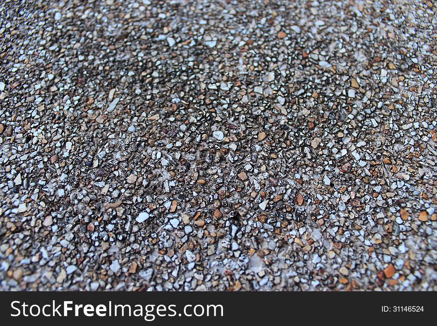 Small stones on the table. Stones hold a table and chairs.A beautiful and delicate.