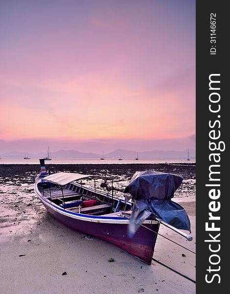 Traditional Thai Longtail Boat at Sunset