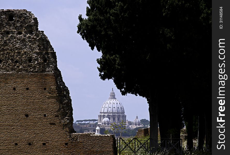 The skyline of the san pietro's cupola viewed by the Augusto house ruins in Palatinum Hill. The skyline of the san pietro's cupola viewed by the Augusto house ruins in Palatinum Hill