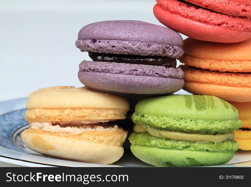 Assorted macarons piling on a plate