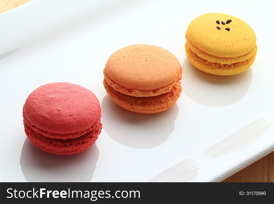 Assorted macarons on a white plate
