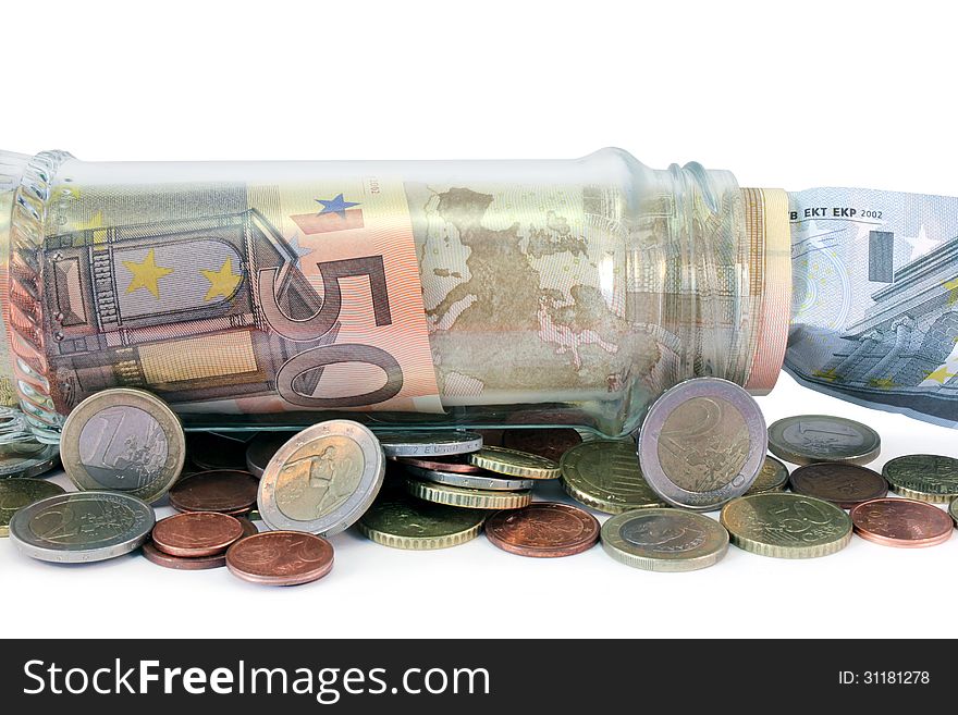 Close up view of money jar full of Euro bank notes and coins. Close up view of money jar full of Euro bank notes and coins.