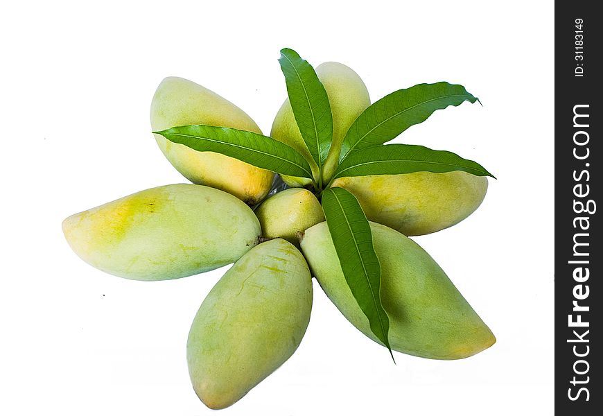 Mangoes in star shape with leaves on top.