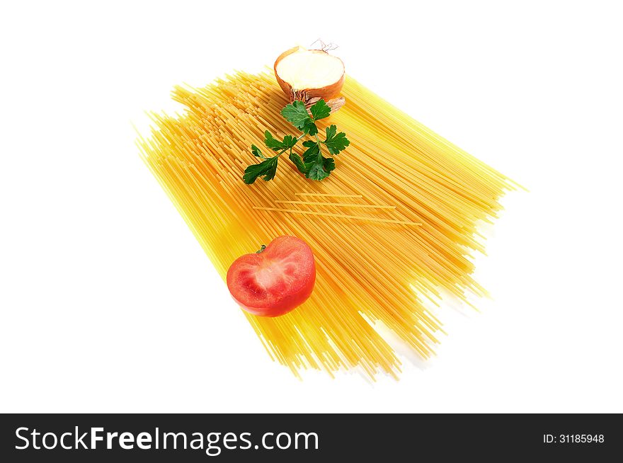 Raw spaghetti decorated with onion, tomato and parsley isolated on white