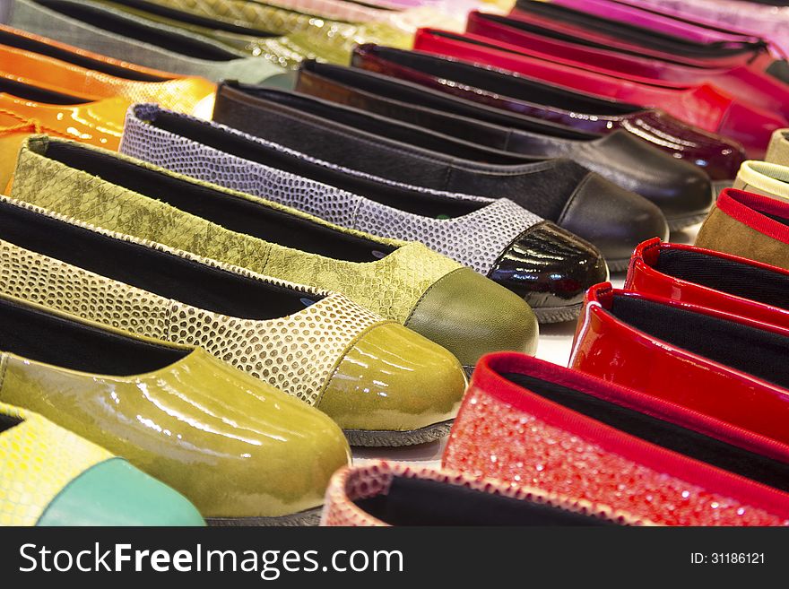 Variety of colorful, shiny shoes. Variety of colorful, shiny shoes