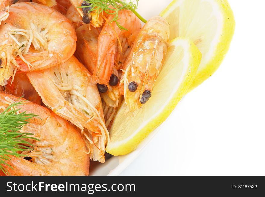 Frame of Delicious Big Boiled Shrimps with Dill and Lemon Slices isolated on white background