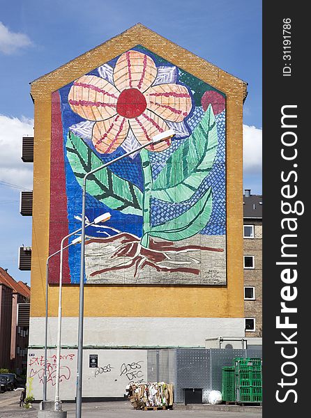 This is a cool mural of a flower in nice summer like colours. It can be found in the citys Ã˜sterbro quarter. This is a cool mural of a flower in nice summer like colours. It can be found in the citys Ã˜sterbro quarter.