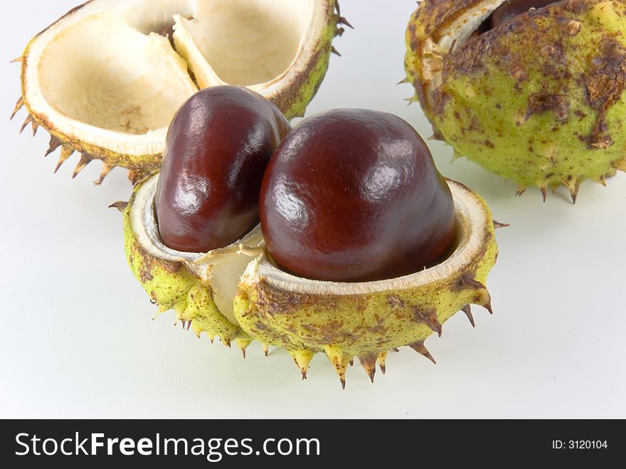 Fresh chestnuts on bright background. Fresh chestnuts on bright background.