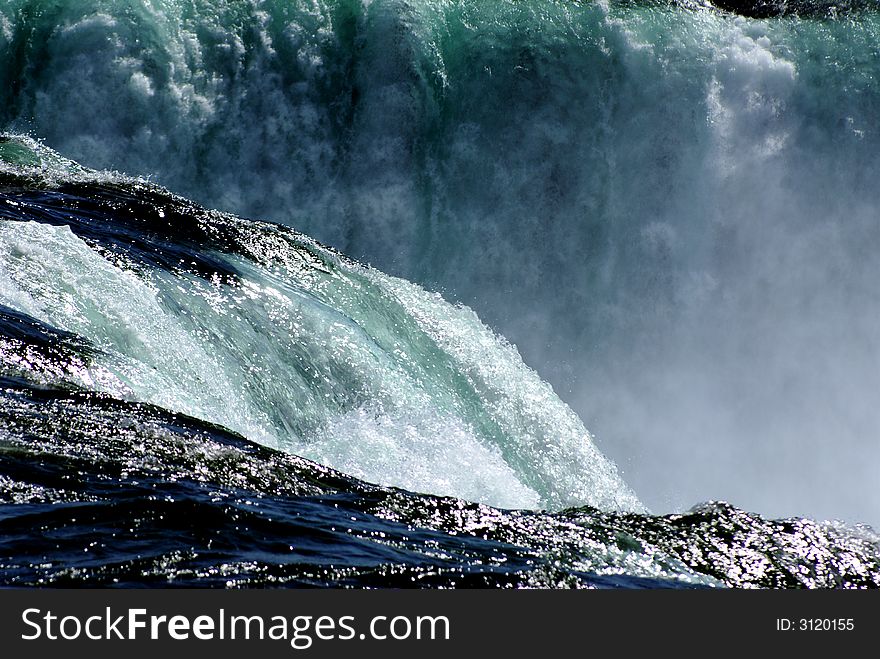 Water rushing over the edge of Niagara Falls. Water rushing over the edge of Niagara Falls