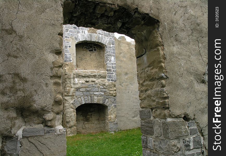 Looking through the doorway of fort ruins.