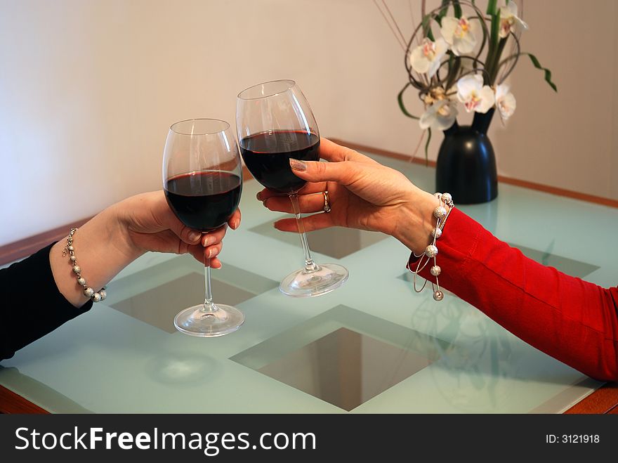 Girlfriends celebrate with red wine. Girlfriends celebrate with red wine