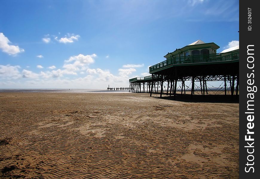 Pier stretching over a barren beach, Lytham St. Anne's England. Pier stretching over a barren beach, Lytham St. Anne's England