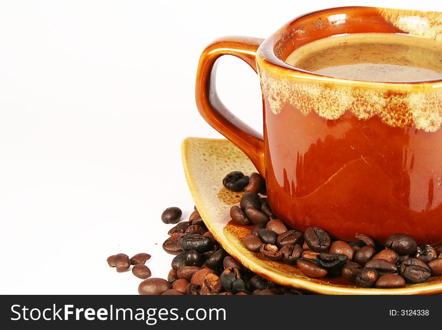 Cup of coffee with coffee beans stimulant white